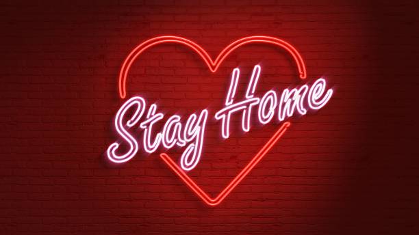 istock Stay Home Neon message on the wall 1215880343