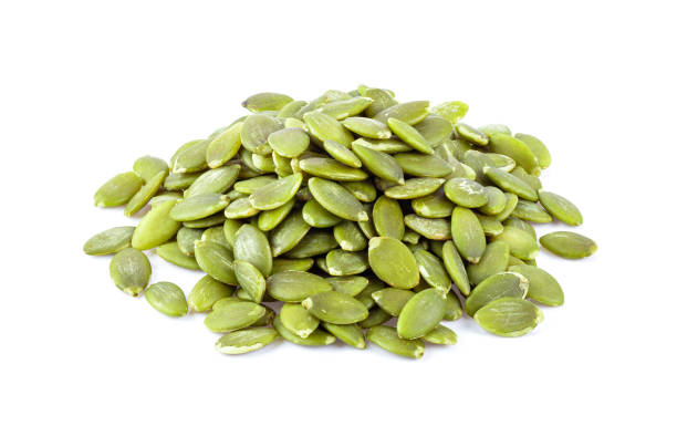 istock Pumpkin seeds on a white background 1215881428