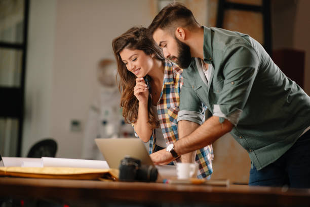 istock Colleagues working together in office. 1215881854