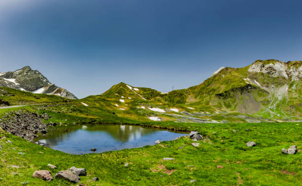 istock Mountain lake at Col de Tente in the Pyrenees 1215885083