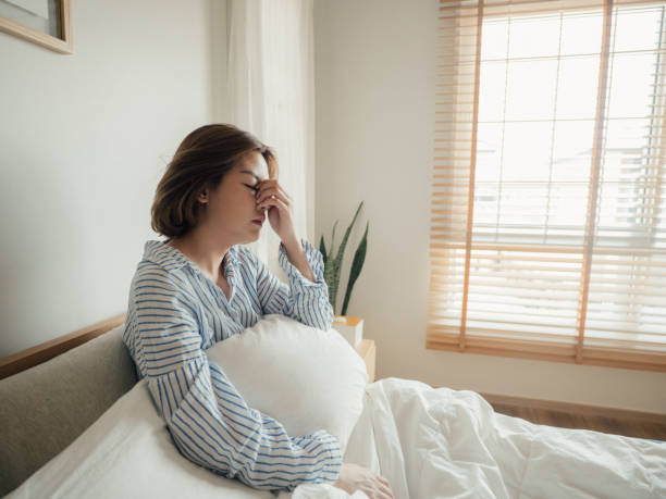 istock Young asian woman feeling sick at home. 1215885448