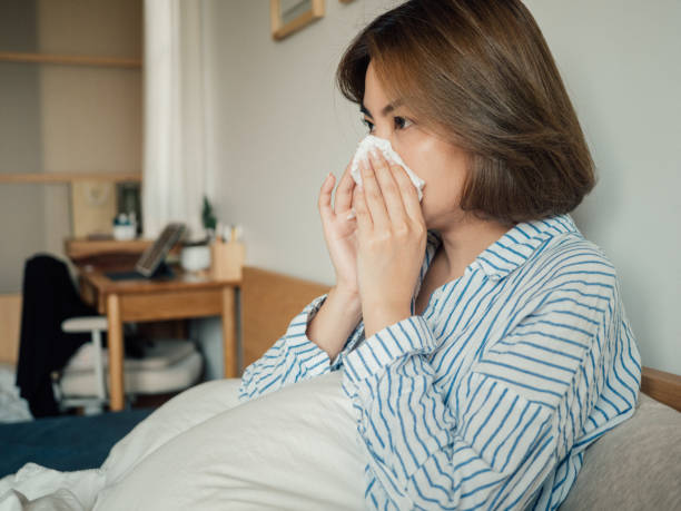istock Woman Lying In Bed Suffering With Cold 1215885684