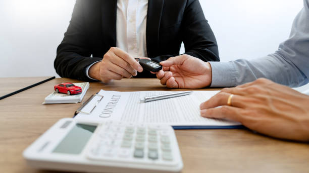 istock agent broker man holding document showing an transportation contract form to client ownership  customer and salesman with car key 1215885789