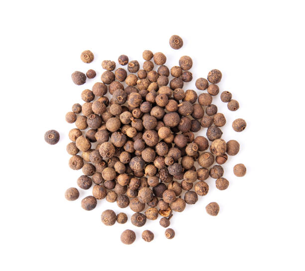 istock Allspice berries (also called Jamaican pepper or newspice) over white background. top view 1215886135