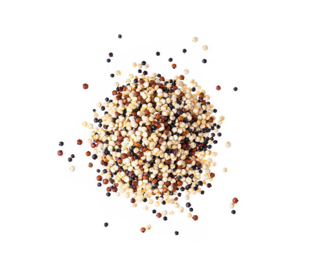 istock Pile of mixed raw quinoa isolated on white background. top view 1215886152