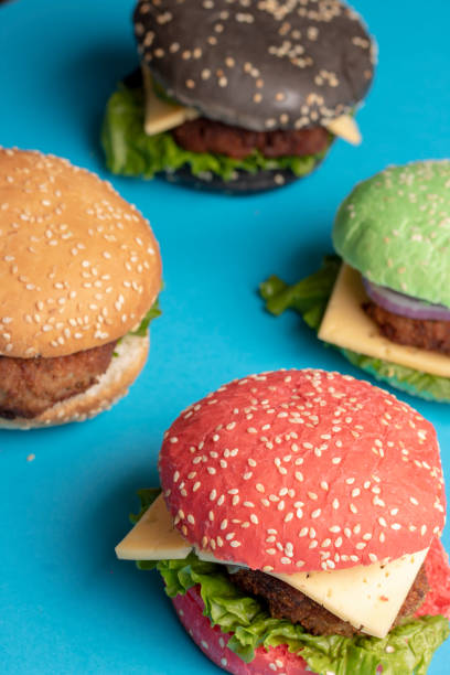 Sesame buns for pink and yellow sandwiches. Colorful buns