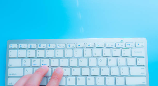 istock Working at home with computer man writing a blog. Man hands on the keyboard 1215888761
