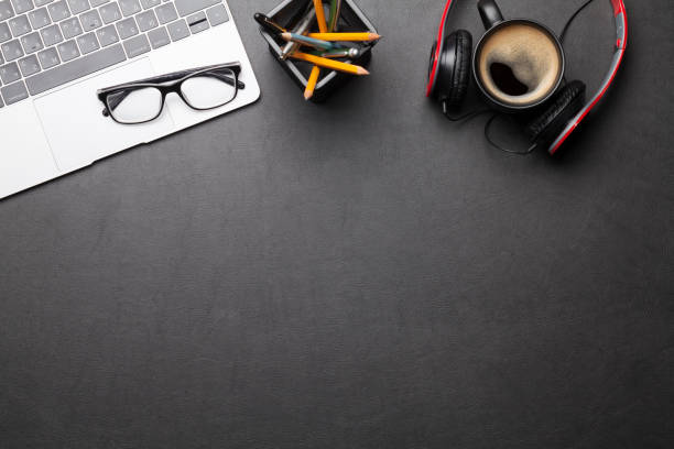 istock Office desk table with supplies and coffee 1215891771
