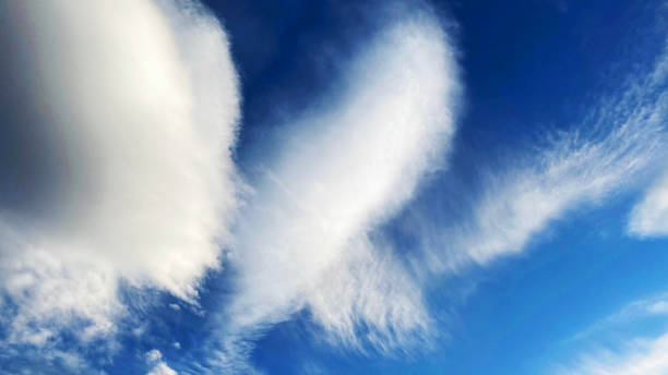 istock Blue sky background with white dramatic colorful clouds and sunlight, vast sky background. Picturesque sky landscape, cloudy blue sky 1215892424
