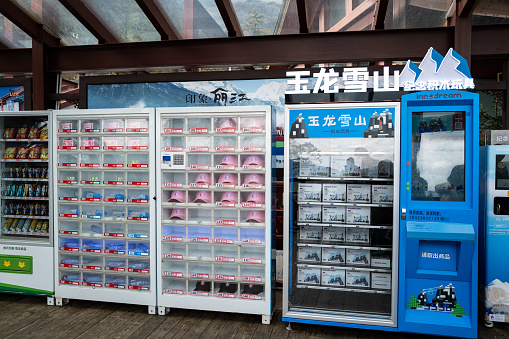 Lijiang, China, October 24, 2019. Tourist souvenir vending machine for Yulong Snow Mountain.