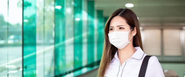 istock woman with mask in station 1215893950