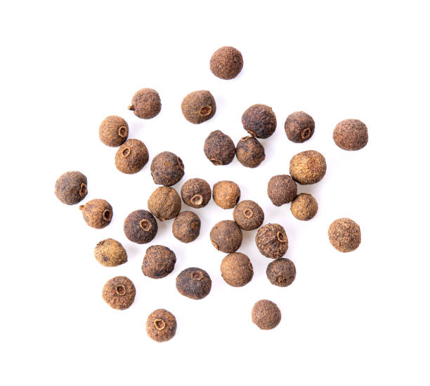istock Allspice berries (also called Jamaican pepper or newspice) over white background. top view 1215894149