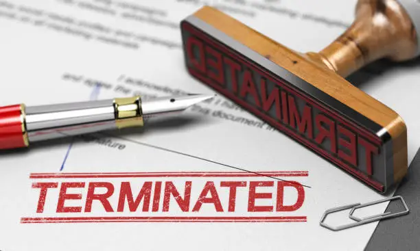 3D illustration of a contract termination agreement letter with a rubber stamp and the word terminated printed on the document.