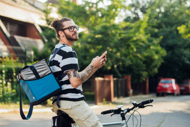 istock Delivery guy searching for the customer's address 1215895467
