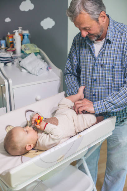 istock Senior man playing with his grandson at home 1215897659