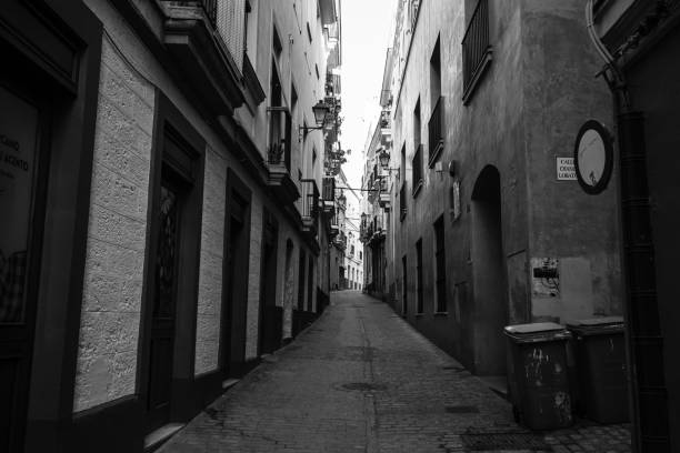 istock Changes and complications caused by coronavirus epidemy, world without crowds, virus empties streets and parks. Almost empty street in Seville, Spain, 2020. 1215897780