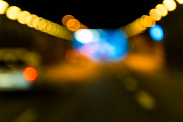 defocused car lights in a tunnel