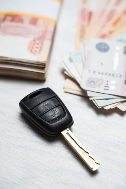 istock car key lies on a table with rubles banknotes 1215898429