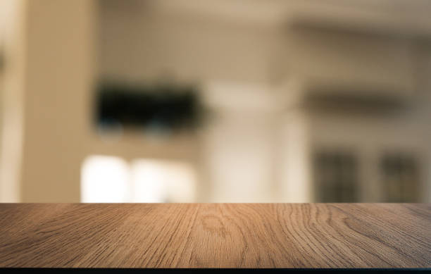 istock Wood Table Top in Blur Background room interior with empty copy space. 1215898787