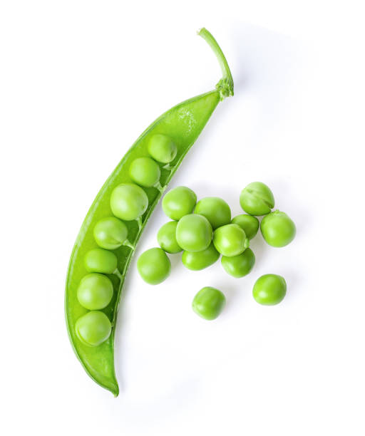 istock Green peas isolated on white background. top view 1215898994