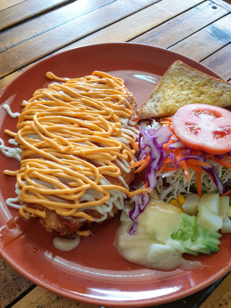 istock Crispy chicken steak with cheese sauce 1215899338