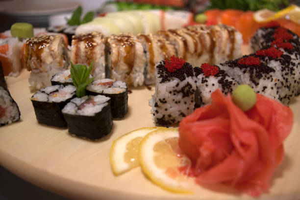 istock sushi roll set on a bamboo plate, seafood close up 1215901858
