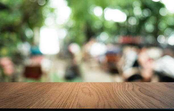 istock Wood Table Top in Blur Background room interior with empty copy space. 1215901891