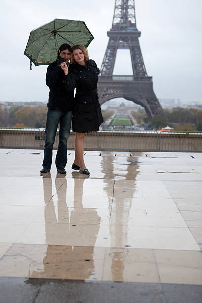 istock Romantic couple near the Eiffel tower at rain 121590304
