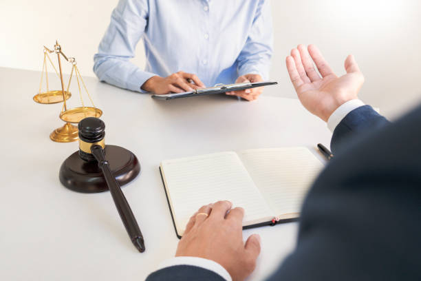 istock Midsection Of Colleagues Discussing In Office 1215905255