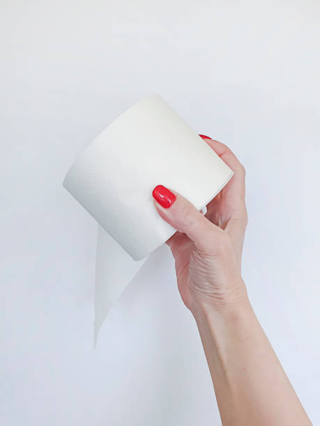 istock female hand holds toilet paper 1215906802