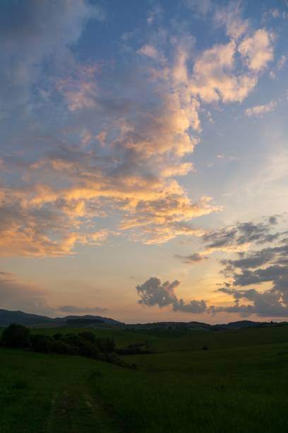 istock Sunrise or sunset over the hills and meadow. 1215907391