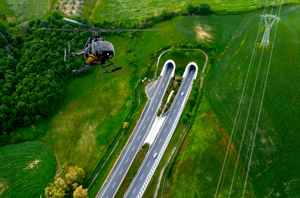 Helicopter monitoring traffic on highway Helicopter monitoring traffic on highway filming point of view highway day road stock pictures, royalty-free photos & images