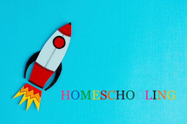 istock Homeschooling text with rocket over blue abstract background. Learn from home concept. Quarantine education. 1215911338