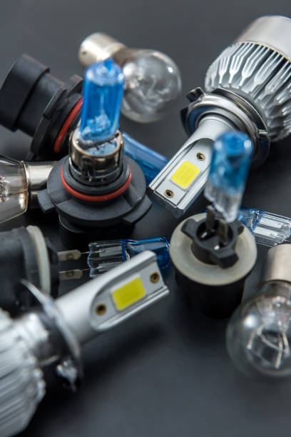 istock different headlight lamp on dark background. Modern diod halogen and other lamp glass 1215912928
