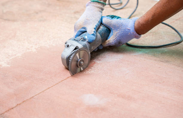 istock Man with grinder cutting a wood plank. 1215915790