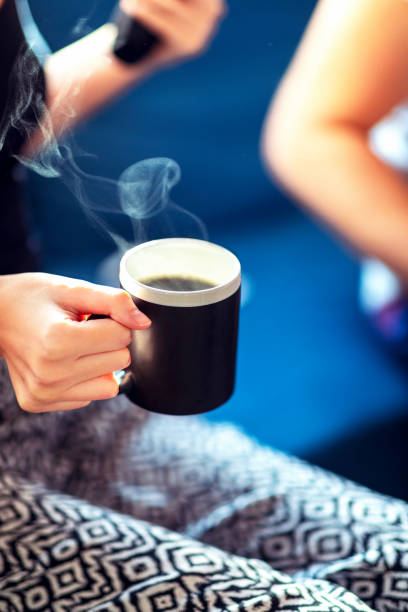 istock Holding a coffee mug in hand 1215916337