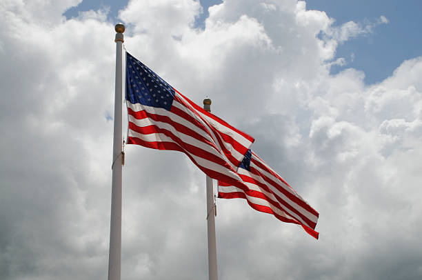 istock Twin American Flags Blowing in the Wind 121591832