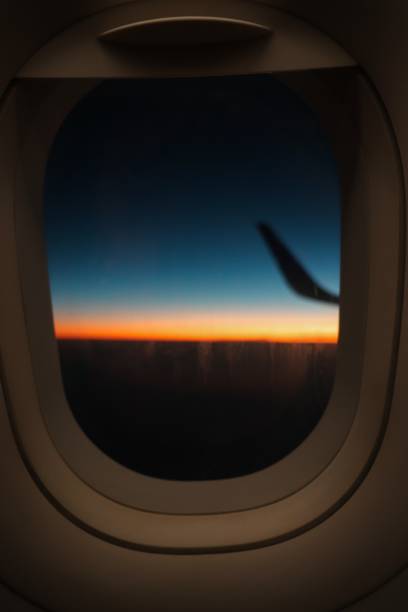 istock Sun rise inside of an airplane 1215922522