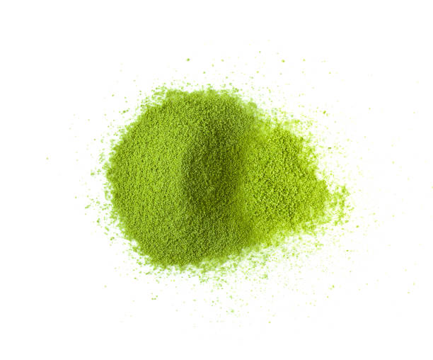 istock Green tea powder on white background 1215925781