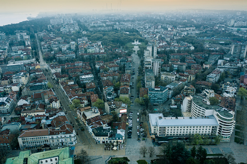 Ruse, Bulgaria - March 27, 2020: City center of Ruse from a drone with lights on. Moody photo.