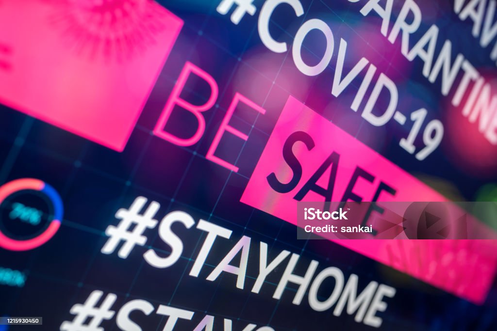 Be safe slogan on digital display. Concept of worldwide quarantine of Covid-19. Analyzing Stock Photo
