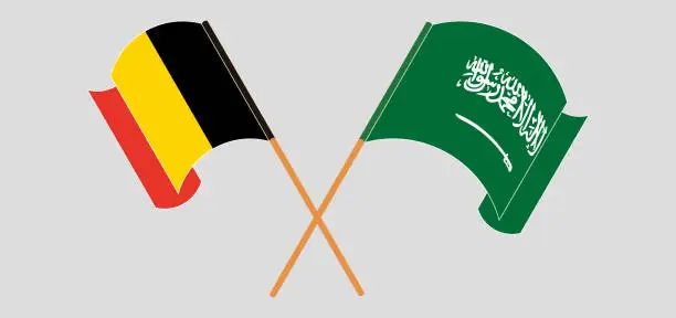 Vector illustration of Crossed and waving flags of Belgium and the Kingdom of Saudi Arabia
