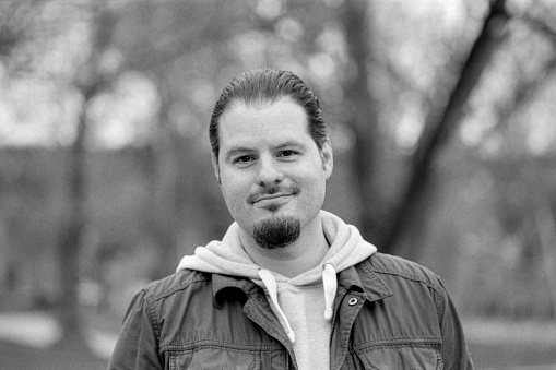 Black and White image taken in the 60s of a young man looking at the camera