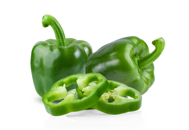 istock Green pepper full depth of field on white background 1215935520