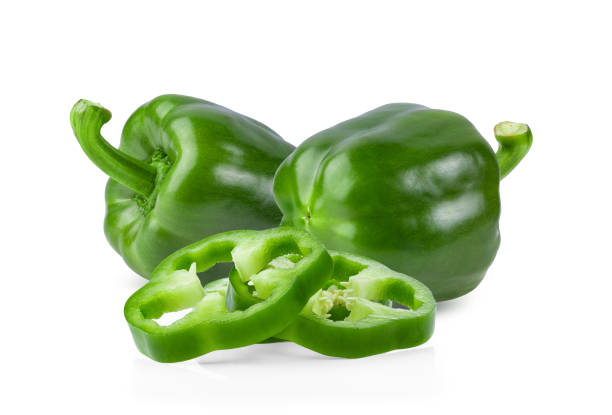 istock Green pepper full depth of field on white background 1215935632