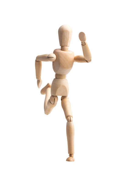 Wooden figure running isolated on white background with clipping paths.