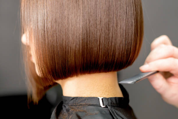 istock Combing hair of woman. 1215938577