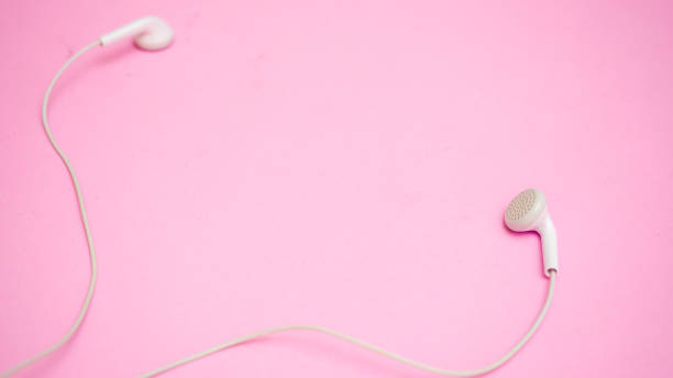 istock earphones on pink bckground 1215943776