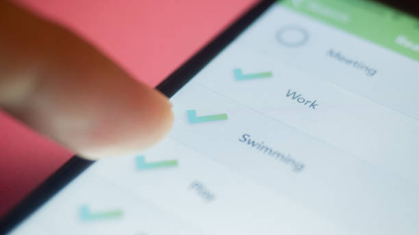 istock checklist box in appication on smarthphone close up. Checklist concept 1215943824