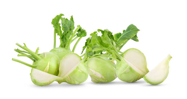 istock Fresh kohlrabi with green leaves on isolated white backround 1215944182